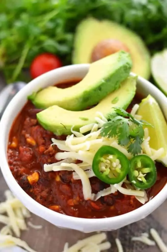 This healthy Slow Cooker Taco Chili makes a great meal any night of the week! It’s super easy to prep and can also be a great freezer meal to add to the rotation. The cooked chili also freezes well! Easy slow cooker dinner recipe from @whattheforkblog | whattheforkfoodblog.com | recipes with ground beef | slow cooker chili recipes | easy dinner recipes | weeknight dinner ideas | slow cooker meal ideas | freezer meal prep