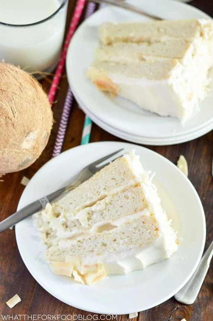 Gluten Free Coconut Cake (and dairy free). This cake is the ultimate dessert for coconut lovers! From @whattheforkblog | whattheforkfoodblog.com