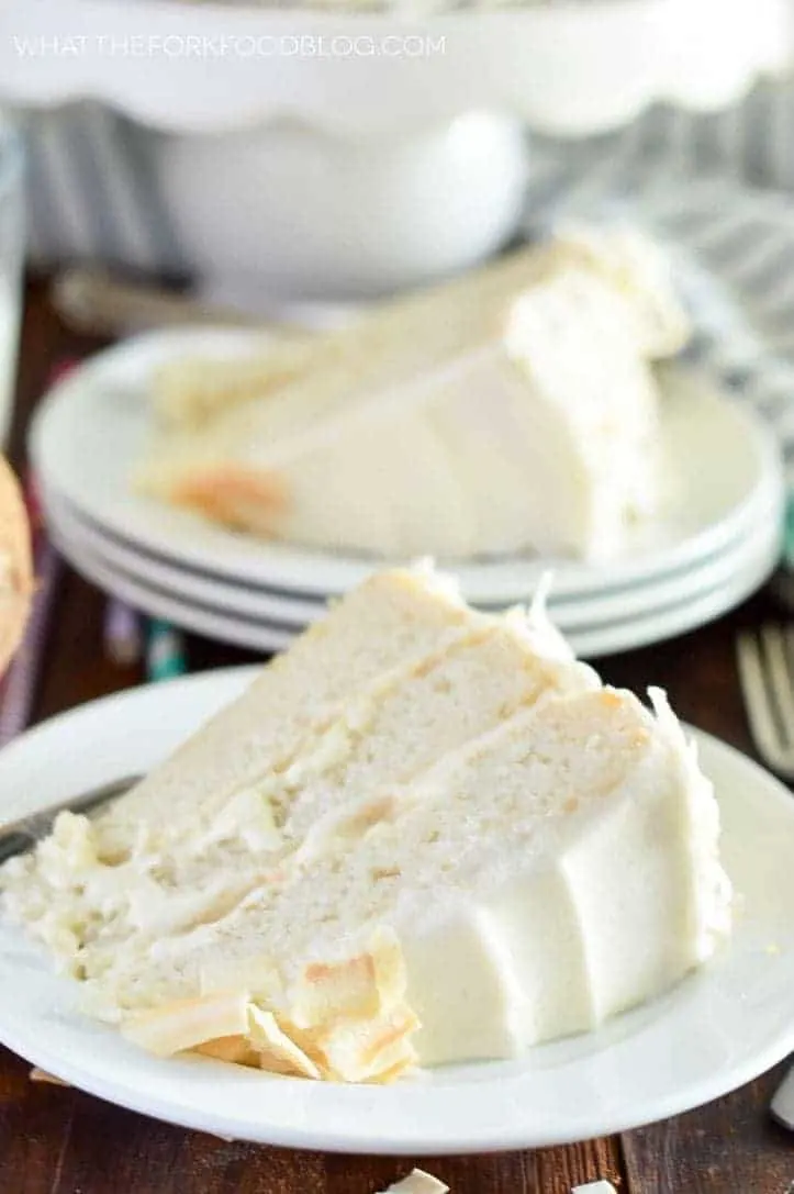 Gluten Free Coconut Cake (and dairy free). This cake is the ultimate dessert for coconut lovers! From @whattheforkblog | whattheforkfoodblog.com