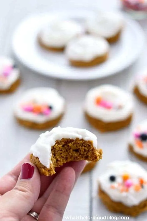 Gluten Free Pumpkin Cookies with Cream Cheese Frosting (dairy free option) are pillowy soft and melt in your mouth. Easy gluten free cookie recipe from @whattheforkblog | whattheforkfoodblog.com | gluten free dairy free pumpkin cookies | soft frosted pumpkin cookies | how to make pumpkin cookies | easy pumpkin cookie recipe | recipes with pumpkin | pumpkin cookie recipe | gluten free cookies | gluten free desserts | easy gluten free recipes | dairy free cookies | leftover pumpkin |