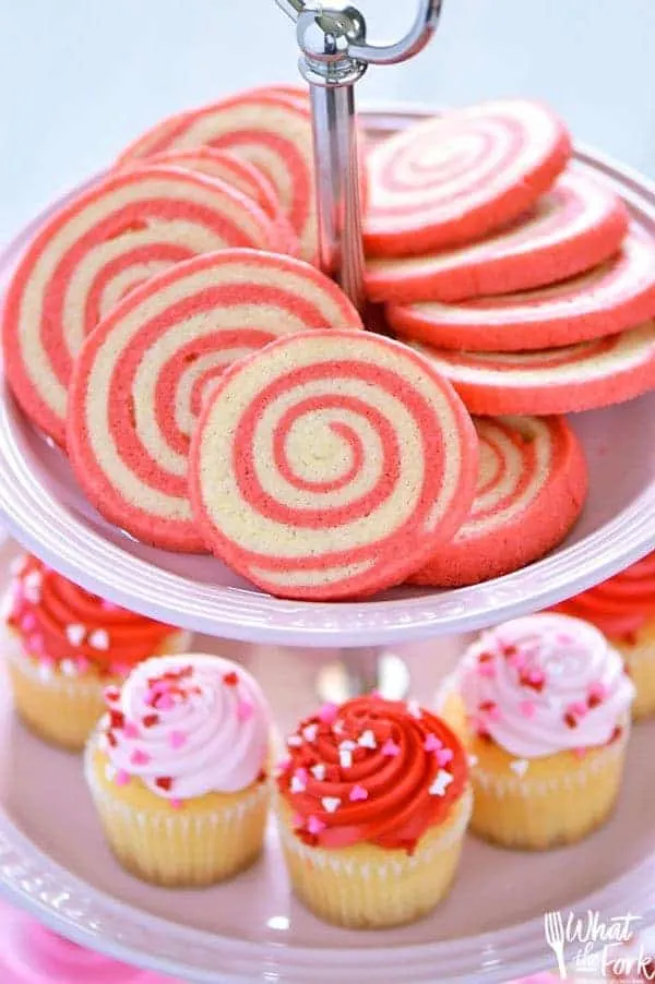 Sweet, crispy Gluten Free Cherry Pinwheel Cookies are a fun twist on a classic cookie recipe and are easier to make then you’d think. The pretty red swirl also makes them great for Valentine’s Day! Recipe from @whattheforkblog | whattheforkfoodblog.com | gluten free cookie recipes | pinwheel cookie recipes | how to make pinwheel cookies