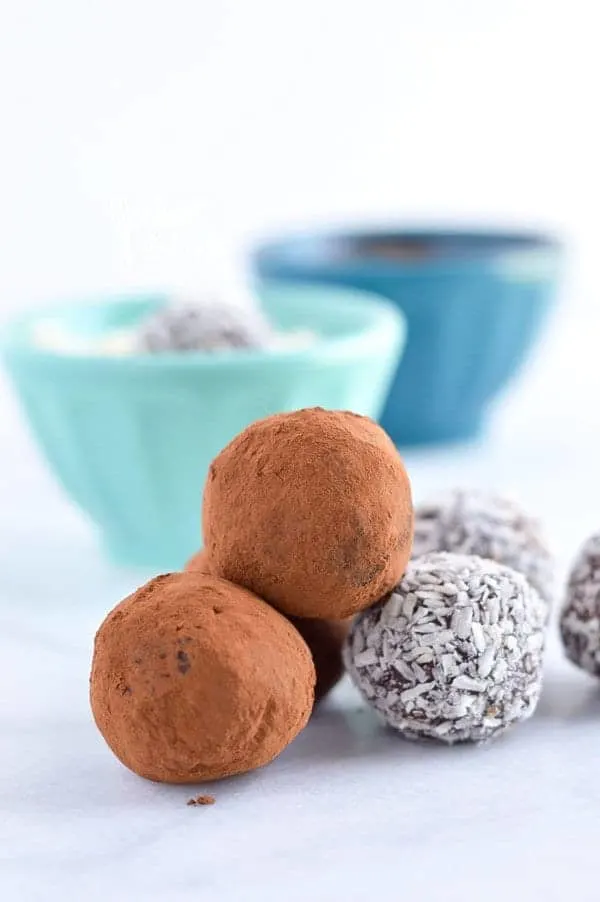 Easy Paleo Chocolate Truffles are so rich and creamy! Plus recipe included 3 ways to top them. Recipe from @whattheforkblog | whattheforkfoodblog.com | healthy recipes | healthy desserts | easy desserts | how to make truffles | dairy free truffles | naturally sweetened