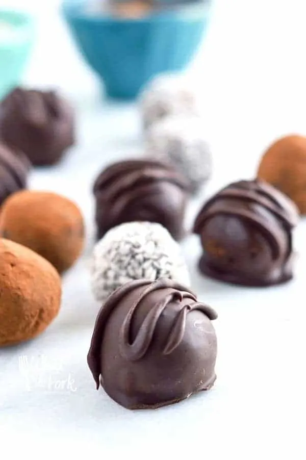 Easy Paleo Chocolate Truffles are so rich and creamy! Plus recipe included 3 ways to top them. Recipe from @whattheforkblog | whattheforkfoodblog.com | healthy recipes | healthy desserts | easy desserts | how to make truffles | dairy free truffles | naturally sweetened