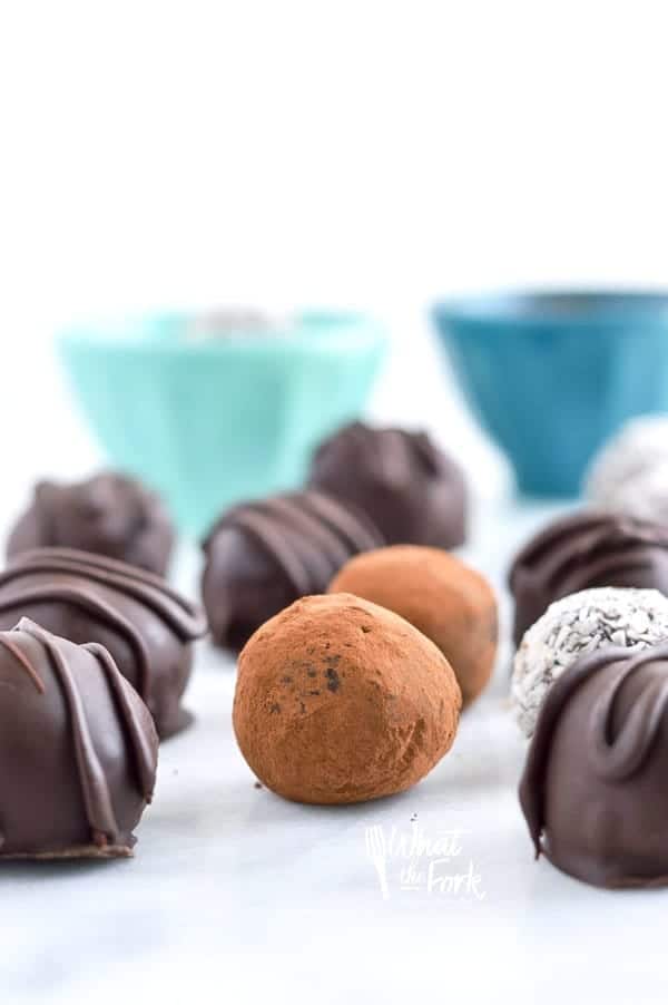 Easy Paleo Chocolate Truffles are so rich and creamy! Plus recipe included 3 ways to top them. Recipe from @whattheforkblog | whattheforkfoodblog.com | healthy recipes | healthy desserts | easy desserts | how to make truffles | dairy free truffles | naturally sweetened