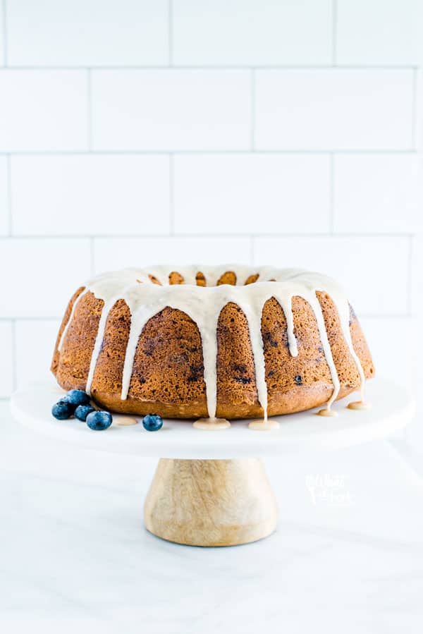 Gluten Free Blueberry Coffee Cake on a marble stand with a wood base