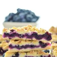 These Gluten Free Blueberry Crumb Bars are made with fresh blueberries and are a really delicious dessert or snack. The crumb is nice and crisp and the lemon zest makes these bright and fresh! Recipe from @whattheforkblog | whattheforkfoodblog.com | gluten free dessert recipes | easy gluten free desserts | summer recipes | summer desserts | recipes for fresh blueberries | fruit desserts