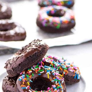 Gluten Free Baked Double Chocolate Donuts are the breakfast you've been craving! They're light and incredibly easy to make. Perfect for Saturday morning or Sunday brunch! These can easily be made dairy free too. Easy donut recipe from @whattheforkblog | whattheforkfoodblog.com | baked donut recipe | baked chocolate donuts | chocolate glaze for donuts | homemade donut recipes | #donuts #doughnuts #glutenfree #easyrecipes #breakfast #chocolate