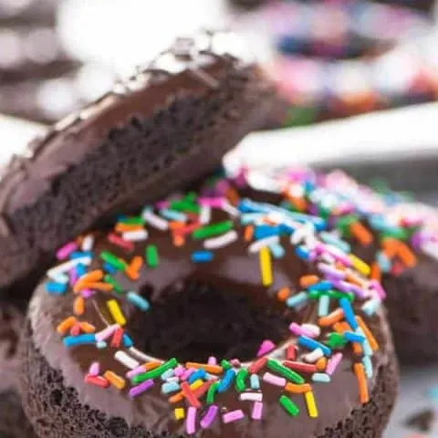 Gluten Free Baked Double Chocolate Donuts are the breakfast you've been craving! They're light and incredibly easy to make. Perfect for Saturday morning or Sunday brunch! These can easily be made dairy free too. Easy donut recipe from @whattheforkblog | whattheforkfoodblog.com | baked donut recipe | baked chocolate donuts | chocolate glaze for donuts | homemade donut recipes | #donuts #doughnuts #glutenfree #easyrecipes #breakfast #chocolate