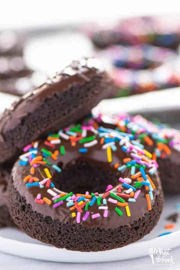 Hero shot of a gluten free baked double chocolate donut with sprinkles on top