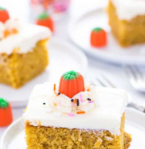 Everyone’s favorite fall dessert: Gluten Free Pumpkin Cake with Cream Cheese Frosting. This cake is so light and moist and has the perfect soft crumb. This is not dense or dry at all! It’s super easy to make too since it’s a sheet cake. Recipe from @whattheforkblog | whattheforkfoodblog.com | gluten free dessert recipes | gluten free cakes | the best pumpkin cake recipe | pumpkin recipes | baking with pumpkin | Fall dessert recipes