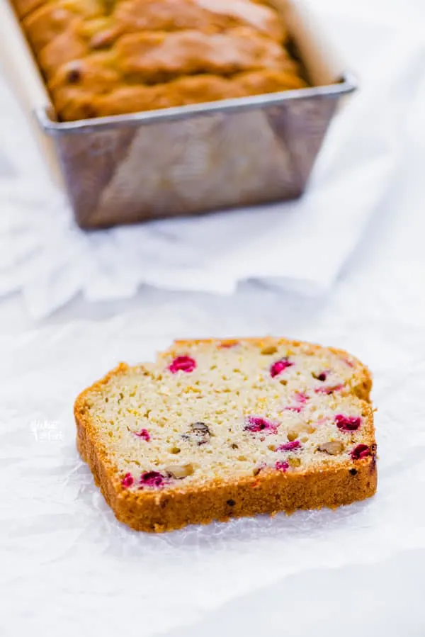 Gluten Free Cranberry Bread is the perfect holiday loaf! It’s got a dairy-free option too! It’s full of flavor thanks to orange zest and extract and fresh cranberries and can be made with dried cranberries. This gluten free quick bread is easy and simple to make. You’d never know it was gluten free! It’s great for gifting too and can be made as four mini loaves. Gluten free bread recipe from @whattheforkblog - visit whattheforkfoodblog.com for more! #glutenfree #quickbread #glutenfreebread