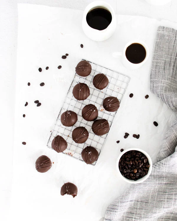 overheard shot of homemade chocolate truffles on a small wire rack