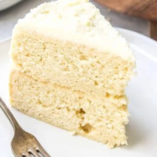 This Gluten Free Eggnog Cake with White Chocolate Ganache Whipped Cream Frosting is the perfect dessert for Christmas! It’s sweet, got a bit of spice from the nutmeg, and just screams holiday season! @whattheforkblog | whattheforkfoodblog.com | gluten free dessert recipes gluten free cake recipes | Eggnog recipes | Christmas recipes | gluten free baking | frosting recipes #glutenfree #Christmas #dessert #cake #cakerecipes #eggnog #baking #ganache #whitechocolate