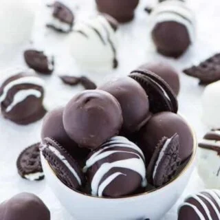 These Gluten Free Oreo Truffles are creamy in the center and coated in a crisp chocolate shell. Easy to make with minimal ingredients.They’re perfect for a homemade gift! Recipe from @whattheforkblog | whattheforkfoodblog.com | gluten free desserts | easy gluten free recipes | gluten free dessert recipes | no bake dessert recipes | #chocolate #Christmas #Oreo #glutenfree #dessert #easyrecipe #nobake #recipe