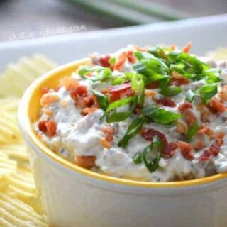 Super Easy Crack Dip - a sour cream based dip with ranch dip mix, cheese and bacon. Totally addicting! Crack Dip Pinterest recipe from @whattheforkblog | whattheforkfoodblog.com | crack dip cold | crack dip recipes | crack dip recipe | cheesy crack dip | crack dip with bacon | how to make crack dip | what is crack dip | award winning crack dip | game day recipes | gluten free appetizer recipes | gluten free dip recipes | easy dip recipes |