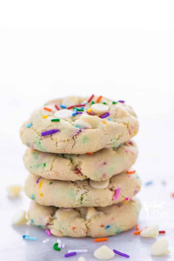 Super easy gluten free cake batter cookies! No chilling time required! Filled with white chocolate chips and loaded with sprinkles, these cookies are crave-worthy! Gluten free cookie recipe from @whattheforkblog | whattheforkfoodblog.com | homemade gluten free cookies | gluten free funfetti cookies | #sprinkles #cookies #funfetti #glutenfree #easyrecipes