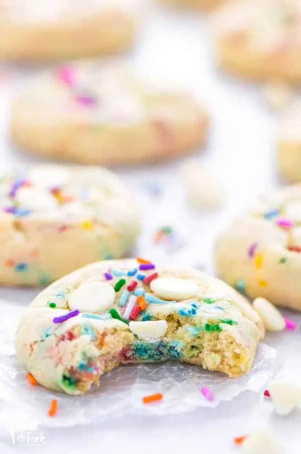 Super easy gluten free cake batter cookies! No chilling time required! Filled with white chocolate chips and loaded with sprinkles, these cookies are crave-worthy! Gluten free cookie recipe from @whattheforkblog | whattheforkfoodblog.com | homemade gluten free cookies | gluten free funfetti cookies | #sprinkles #cookies #funfetti #glutenfree #easyrecipes