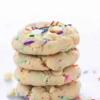 Super easy gluten free cake batter cookies! No chilling time required! Filled with white chocolate chips and loaded with sprinkles, these cookies are crave-worthy! Gluten free cookie recipe from @whattheforkblog | whattheforkfoodblog.com | homemade gluten free cookies | gluten free funfetti cookies | #sprinkles #cookies #funfetti #glutenfree #easyrecipes