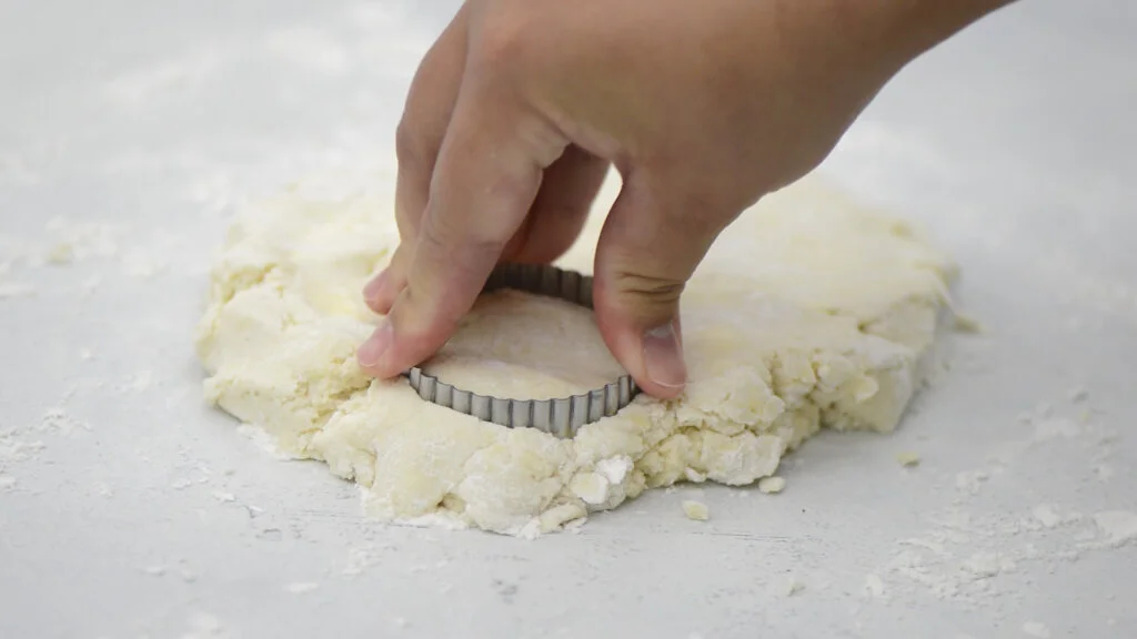 Use a 2 inch biscuit cutter to cut out the biscuits. Gently re-roll dough as needed.