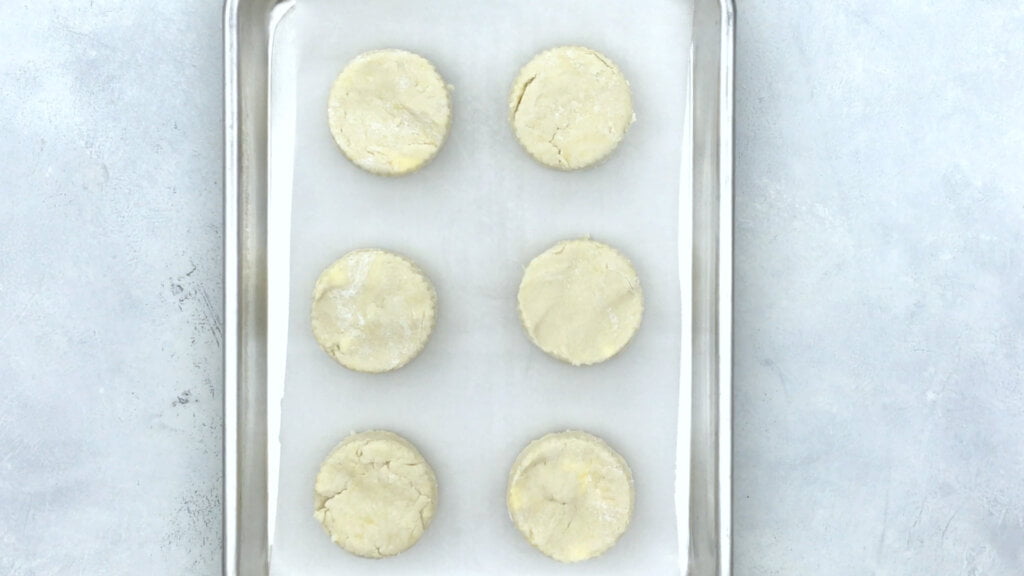 Place biscuits on an ungreased cookie sheet  and refrigerate for 30 minutes before baking. Bake for 12-15 minutes or until done- think golden brown.