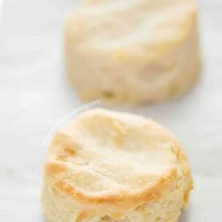 These easy and simple Gluten Free Biscuits are a adapted from my mom’s biscuit recipe. These buttery, flaky, fluffy gluten free biscuits are everything you want in a biscuit! Gluten free biscuit recipe from @whattheforkblog | whattheforkfoodblog | easy biscuit recipe | how to make biscuits | gluten free biscuits and gravy | fluffy gluten free biscuits | gluten free dairy free biscuits | dairy free option | homemade biscuits | breakfast biscuits