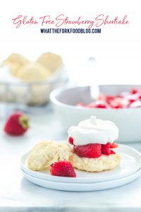 Easy gluten free strawberry shortcake is made with gluten free drop biscuits that are topped with sweetened strawberries and homemade whipped cream. It's the perfect late spring and early summer dessert during strawberry season. This recipe is best with fresh strawberries! Easy gluten free dessert recipe from @whattheforkblog - visit whattheforkfoodblog.com for more gluten free dessert recipes! #glutenfree #strawberry #strawberryshortcake #dessert #glutenfreedessert #easyrecipe