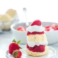 Gluten Free Strawberry Shortcake made with gluten free drop biscuits, sweetened strawberries, and homemade whipped cream.