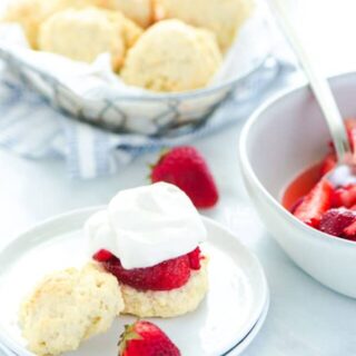 Easy gluten free strawberry shortcake is made with gluten free drop biscuits that are topped with sweetened strawberries and homemade whipped cream. It's the perfect late spring and early summer dessert during strawberry season. This recipe is best with fresh strawberries! Easy gluten free dessert recipe from @whattheforkblog - visit whattheforkfoodblog.com for more gluten free dessert recipes! #glutenfree #strawberry #strawberryshortcake #dessert #glutenfreedessert #easyrecipe