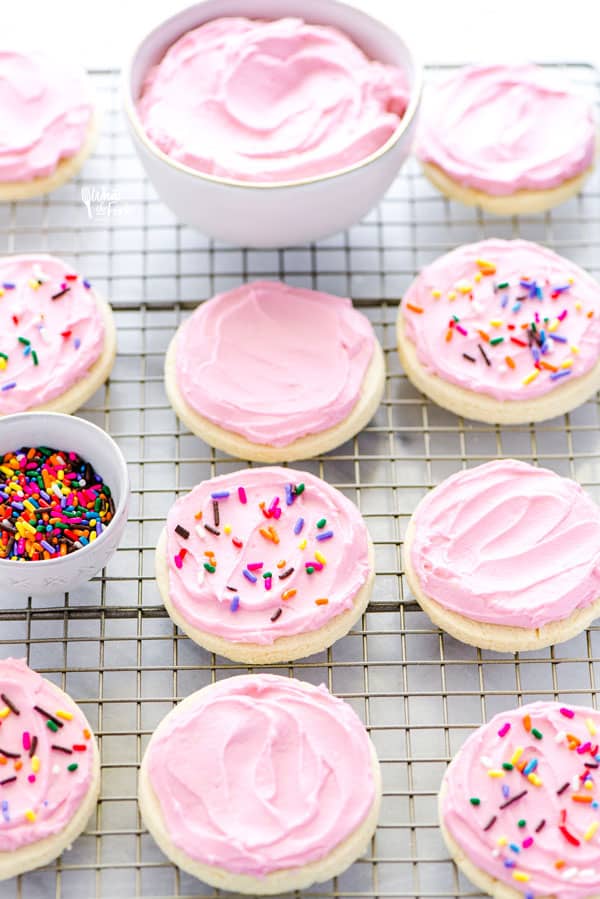 Cut out no chill Gluten Free Frosted Sugar Cookies are a must-make. Frost them and top them with sprinkles for a gluten free dessert recipe that’s perfect for a party or for the holidays. You can decorate them with royal icing if you prefer! Gluten free and dairy free cookie recipe from @whattheforkblog - visit www.whattheforkfoodblog.com for more easy gluten free desserts and gluten free cookies! #glutenfree #dairyfree #sugarcookies #frostedsugarcookies #cutoutsugarcookies #glutenfreecookies