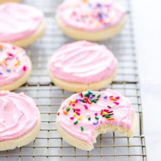 Cut out no chill Gluten Free Frosted Sugar Cookies are a must-make. Frost them and top them with sprinkles for a gluten free dessert recipe that’s perfect for a party or for the holidays. You can decorate them with royal icing if you prefer! Gluten free and dairy free cookie recipe from @whattheforkblog - visit www.whattheforkfoodblog.com for more easy gluten free desserts and gluten free cookies! #glutenfree #dairyfree #sugarcookies #frostedsugarcookies #cutoutsugarcookies #glutenfreecookies