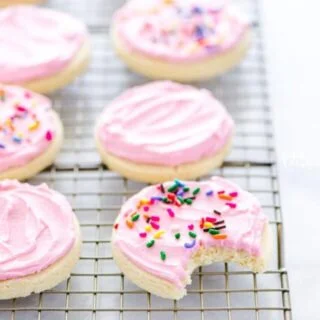 Cut out no chill Gluten Free Frosted Sugar Cookies are a must-make. Frost them and top them with sprinkles for a gluten free dessert recipe that’s perfect for a party or for the holidays. You can decorate them with royal icing if you prefer! Gluten free and dairy free cookie recipe from @whattheforkblog - visit www.whattheforkfoodblog.com for more easy gluten free desserts and gluten free cookies! #glutenfree #dairyfree #sugarcookies #frostedsugarcookies #cutoutsugarcookies #glutenfreecookies