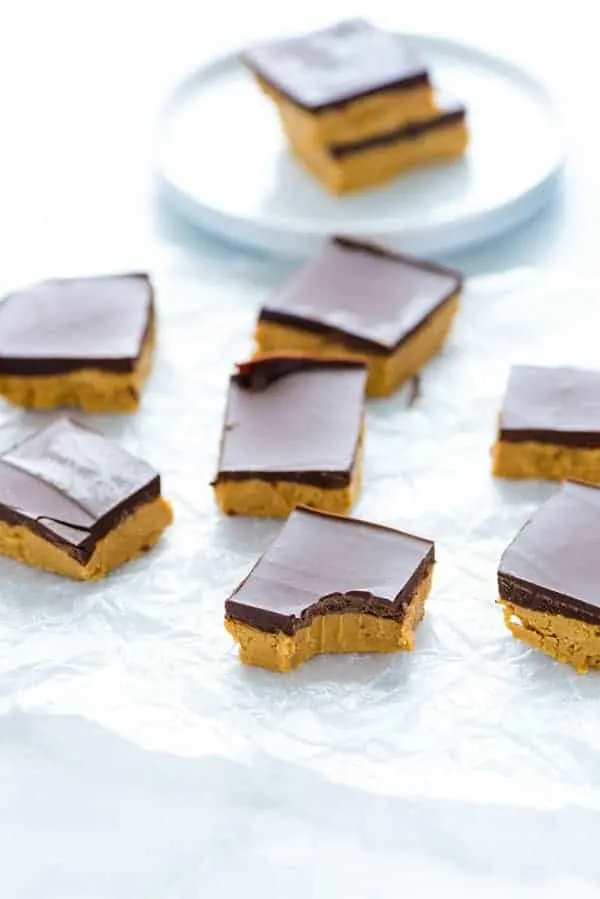 Gluten Free Chocolate Peanut Butter bars on the counter with bite taken out