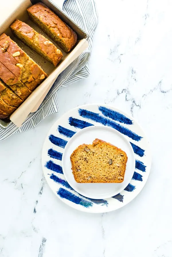 This wildly popular Gluten Free Pumpkin Banana Bread is a mix of two popular quick bread recipes - pumpkin bread and banana bread! Your fall baking starts here! This recipe can be made dairy-free or with regular milk. This easy gluten free quick bread recipe is from @whattheforkblog - visit whattheforkfoodblog.com for more! #glutenfree #dairyfree #fallbaking #pumpkin #pumpkinrecipes #easyrecipes #glutenfreebaking #fallrecipes #Fall #pumpkinbread #bananabread #pumpkinbanana #quickbread #bread