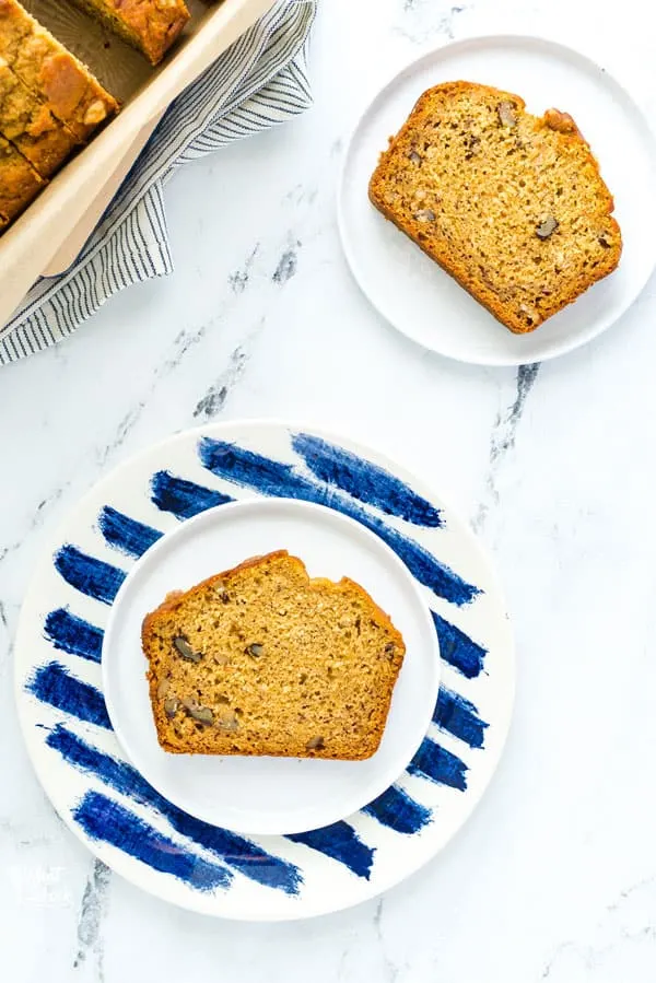 This wildly popular Gluten Free Pumpkin Banana Bread is a mix of two popular quick bread recipes - pumpkin bread and banana bread! Your fall baking starts here! This recipe can be made dairy-free or with regular milk. This easy gluten free quick bread recipe is from @whattheforkblog - visit whattheforkfoodblog.com for more! #glutenfree #dairyfree #fallbaking #pumpkin #pumpkinrecipes #easyrecipes #glutenfreebaking #fallrecipes #Fall #pumpkinbread #bananabread #pumpkinbanana #quickbread #bread