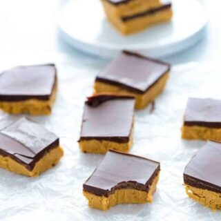 Gluten Free Chocolate Peanut Butter bars on the counter with bite taken out