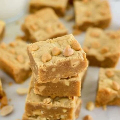 Gluten Free Peanut Butter Blondies (with dairy free option) packed full of flavor from peanuts 3 ways. Recipe from @whattheforkblog | whattheforkfoodblog.com | Sponsored by Naturally More
