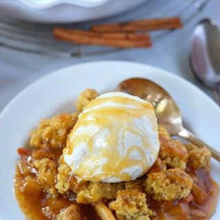 Gluten Free Caramel Apple Crisp for the perfect fall dessert. Dairy free option. Recipe from @whattheforkblog | whattheforkfoodblog.com | Desserts for fall | apple recipes | how to make apple crisp | apple crisp recipe | easy apple crisp |