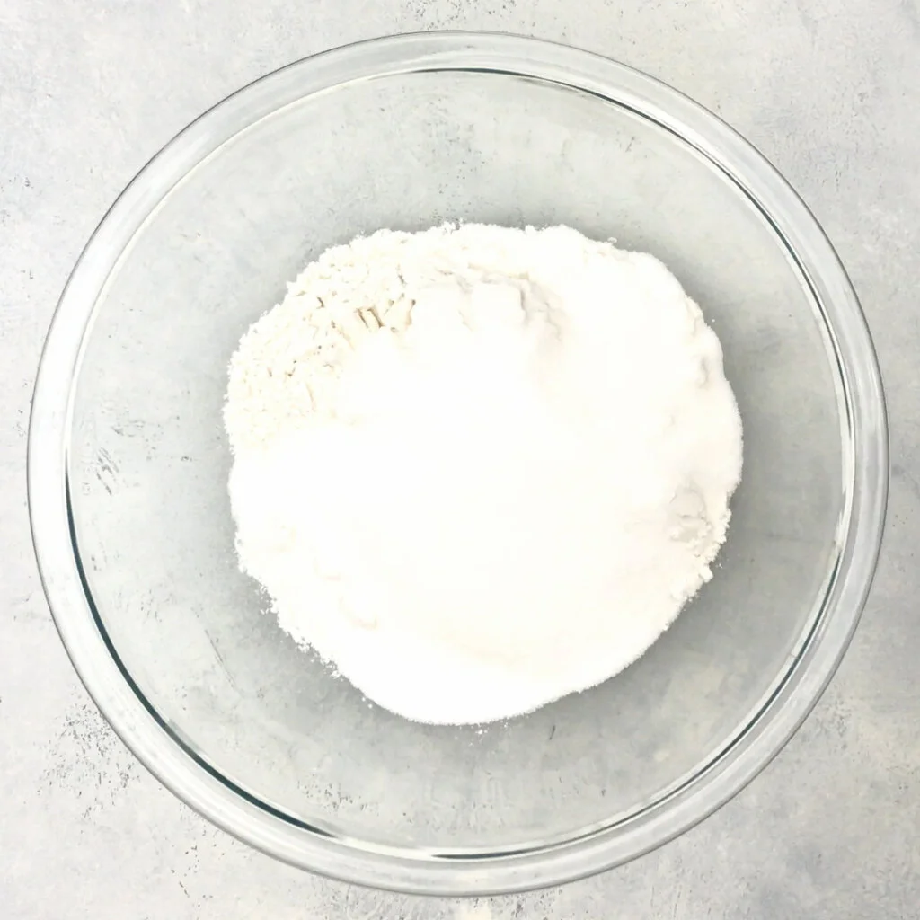 whisk together the flour, xanthan gum, baking powder, baking soda, salt, granulated sugar, and brown sugar. 