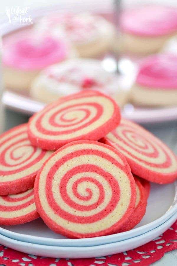 Sweet, crispy Gluten Free Cherry Pinwheel Cookies are a fun twist on a classic cookie recipe and are easier to make then you’d think. The pretty red swirl also makes them great for Valentine’s Day! Recipe from @whattheforkblog | whattheforkfoodblog.com | gluten free cookie recipes | pinwheel cookie recipes | how to make pinwheel cookies