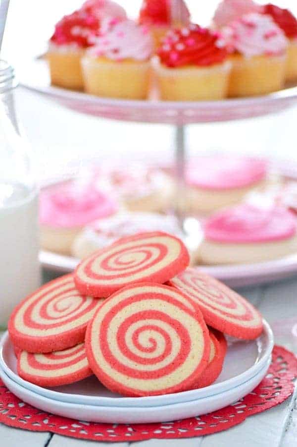 Sweet, crispy Gluten Free Cherry Pinwheel Cookies are a fun twist on a classic cookie recipe and are easier to make then you’d think. The pretty red swirl also makes them great for Valentine’s Day! Recipe from @whattheforkblog | whattheforkfoodblog.com | gluten free cookie recipes | pinwheel cookie recipes | how to make pinwheel cookies