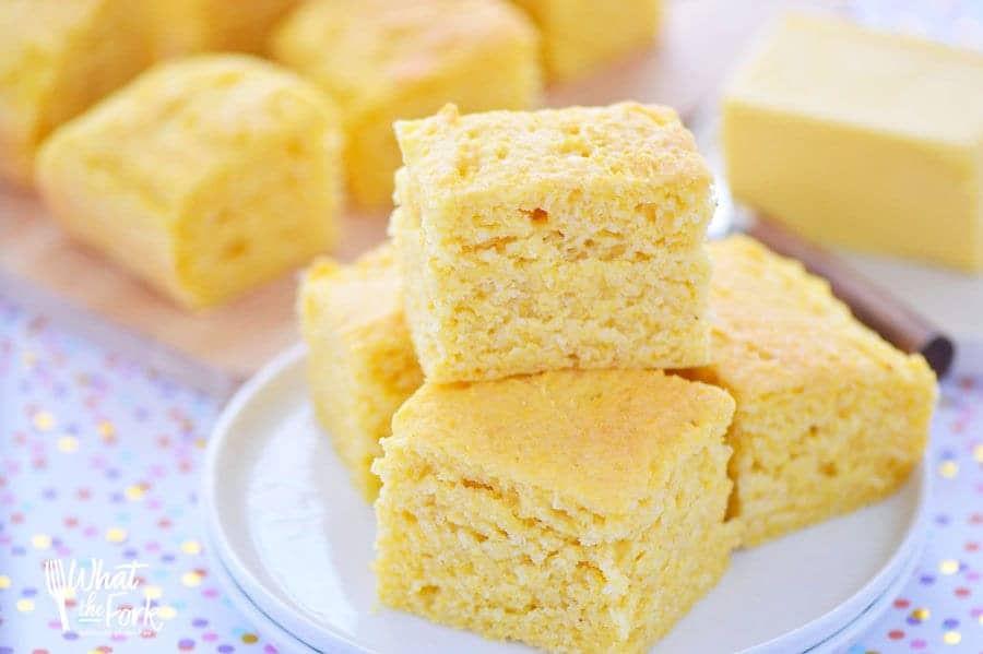 This super quick and easy gluten free cornbread recipe is sure to be a family hit. It's can easily be made dairy free too! Serve it for a dinner side dish with chili, or bbq, or even have it for breakfast with a drizzle of honey. Recipe from @whattheforkblog | whattheforkfoodblog.com | gluten free bread recipes | easy gluten free recipes | gluten free baking | how to make gluten free cornbread | the best gluten free cornbread recipe