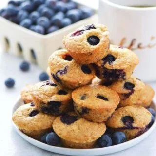 Quick and easy Gluten Free Mini Blueberry Muffins make a great grab-and-go breakfast or snack. Recipe from @whattheforkblog | whattheforkfoodblog.com | gluten free breakfast recipes | blueberry mini muffins | blueberry muffins recipe | muffin recipes | best blueberry muffins | homemade blueberry muffins | dairy free muffin recipes | gluten free muffins |