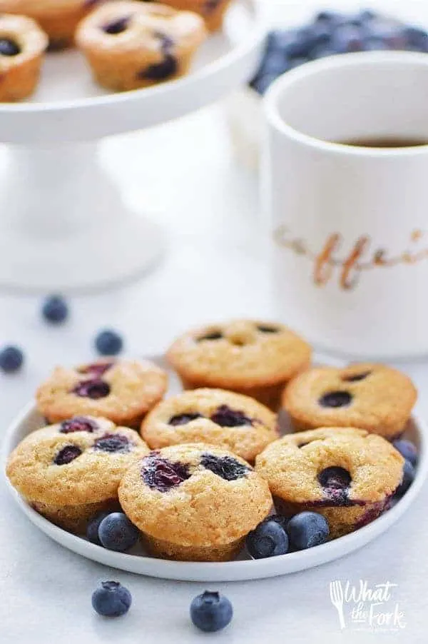 Quick and easy Gluten Free Mini Blueberry Muffins make a great grab-and-go breakfast or snack. Recipe from @whattheforkblog | whattheforkfoodblog.com | gluten free breakfast recipes | blueberry mini muffins | blueberry muffins recipe | muffin recipes | best blueberry muffins | homemade blueberry muffins | dairy free muffin recipes | gluten free muffins | 