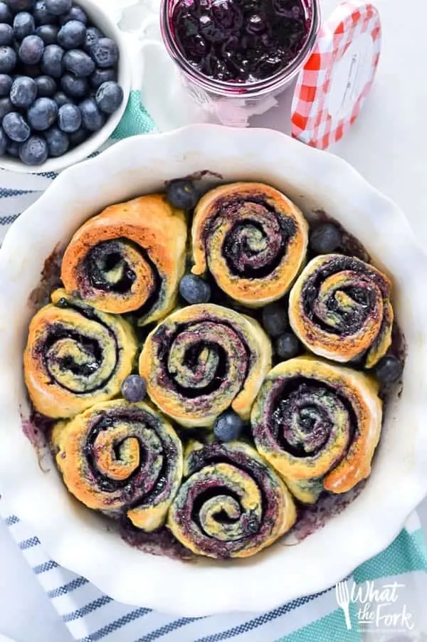 1-Hour Gluten Free Blueberry Sweet Rolls - perfect for brunch! Recipe from @whattheforkblog | whattheforkfoodblog.com | Sponsored by Bonne Maman | gluten free baking | easy gluten free recipes | gluten free bread recipes | yeast rolls | brunch recipes | sweet roll recipes | homemade dough recipes |