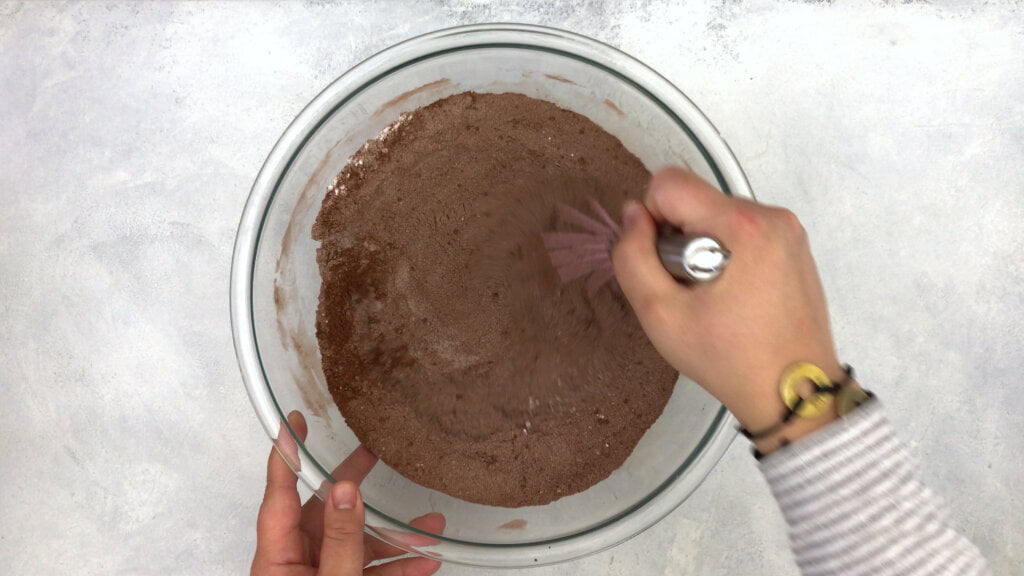 
Step 1. Firstly, in the bowl of a stand mixer or hand mixer, sift together the flour, xanthan gum, sugar, cocoa powder, baking soda, baking powder and salt.