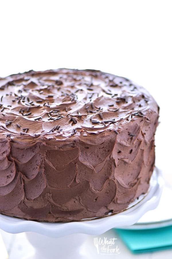 Moist gluten free chocolate cake on stand