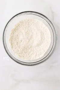 dry ingredients whisked together in a bowl to make gluten free vanilla cupcakes