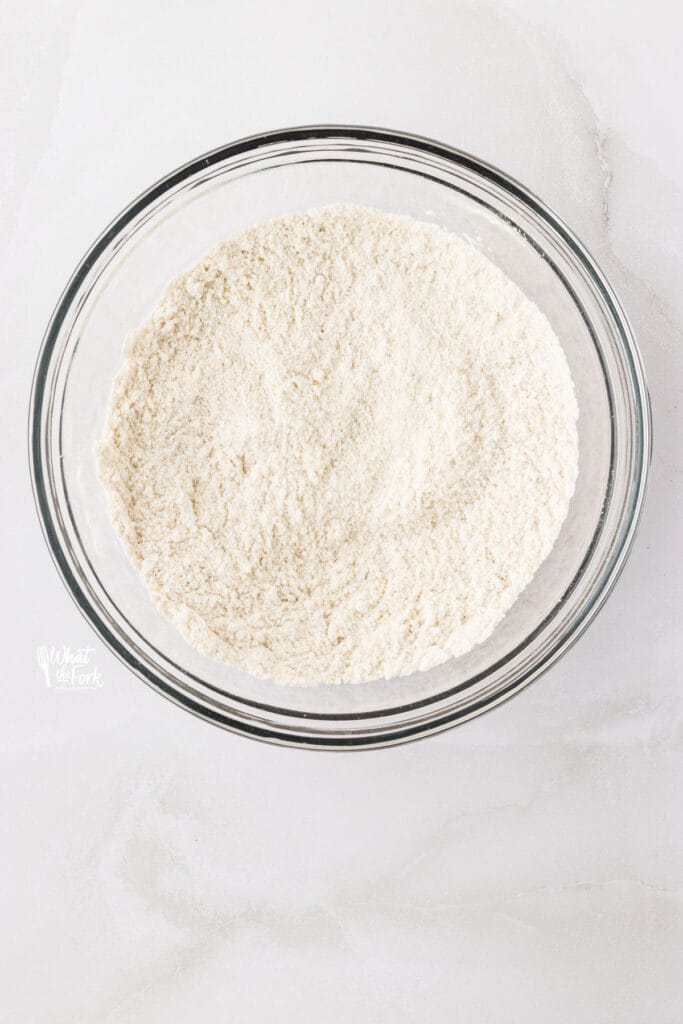 dry ingredients whisked together in a bowl to make gluten free vanilla cupcakes