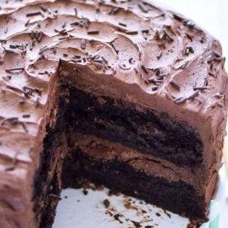 This is the BEST gluten free chocolate cake recipe out there! So moist, so rich, and so full of chocolate flavor! It's always the hit of the party! Recipe from @whattheforkblog | whattheforkfoodblog.com | gluten free dessert recipes | easy desserts | cake recipes from scratch | homemade chocolate cake | gluten free cakes | birthday cakes | gluten free birthday cake recipes | chocolate cake from scratch