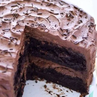 This is the BEST gluten free chocolate cake recipe out there! So moist, so rich, and so full of chocolate flavor! It's always the hit of the party! Recipe from @whattheforkblog | whattheforkfoodblog.com | gluten free dessert recipes | easy desserts | cake recipes from scratch | homemade chocolate cake | gluten free cakes | birthday cakes | gluten free birthday cake recipes | chocolate cake from scratch